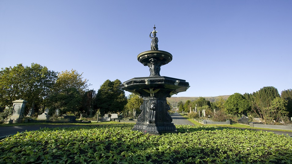 Fountain in a flower bed within a cemetery