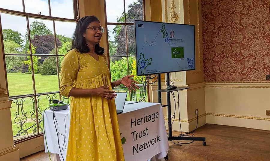 A woman from an indian background giving a talk