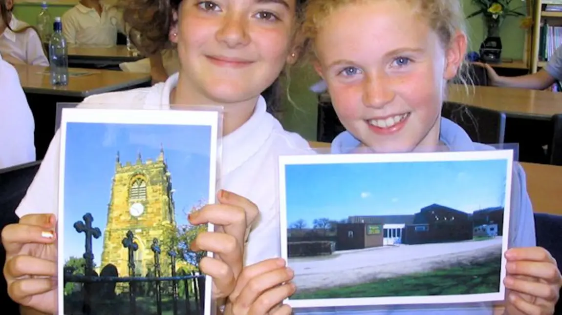 Children sharing photographs of Beighton